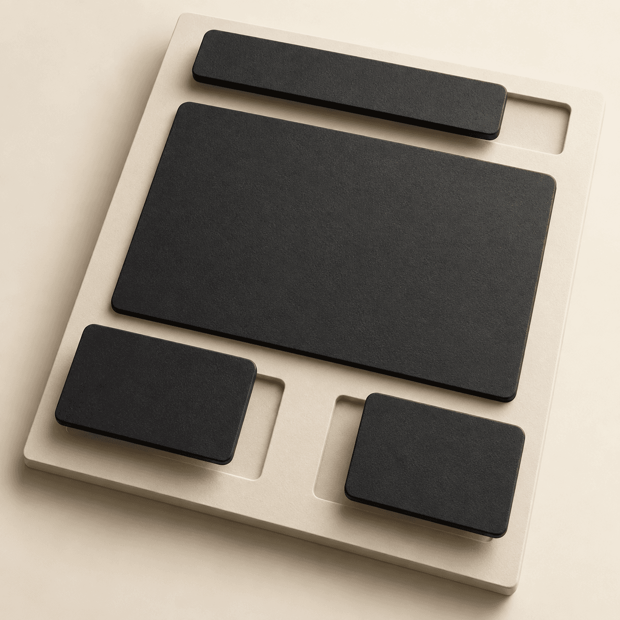 A tactile black and cream modular website layout viewed from above